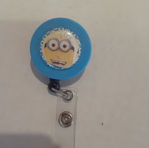 Retractable name badge holder